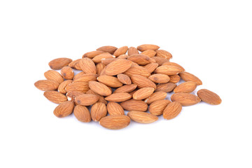 pile of dry almond seeds on white background
