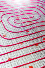 Floor heating pipe. Installation of engineering systems in a building.