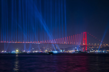 Fototapeta na wymiar Fireworks over Istanbul Bosphorus during Turkish Republic Day celebrations. 15th July Martyrs Bridge (15 Temmuz Sehitler Koprusu). Istanbul, Turkey..
