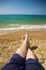 male feet at beach