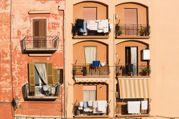 Drying of clothes on italian street.