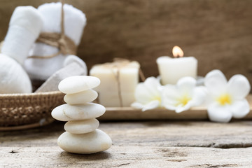 White zen stones,beauty and skincare products  products on wooden background