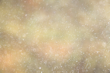 Snowfall texture of snowflakes on blurred background