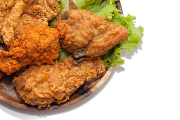 fried chickens on wooden plate