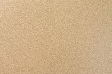 Metal surface in golden color with porous heterogeneous texture