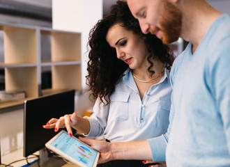 Fototapeta premium Software engineers using digital tablet in office