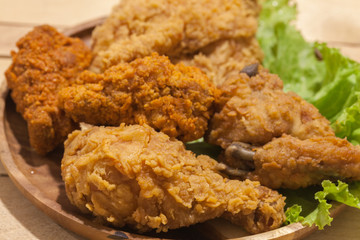 fried chickens on wooden plate