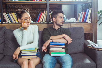 multiethnic couple with books