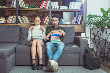 couple with books in library