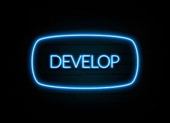 Develop  - colorful Neon Sign on brickwall