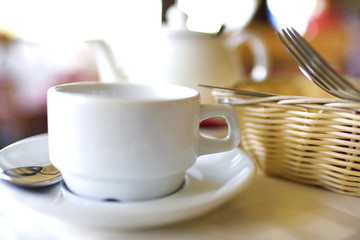 Kettle and a cup on the table