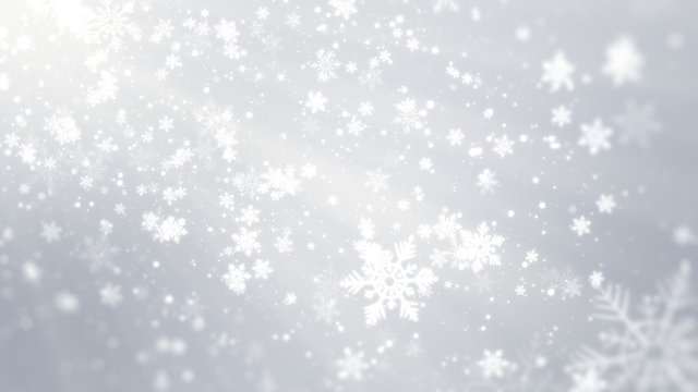 White bokeh, snowflakes and shiny lights on white background with Christmas theme.