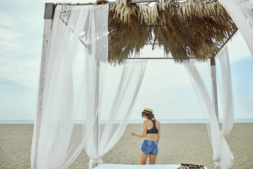 Woman Dancing on the Beach © LStockStudio
