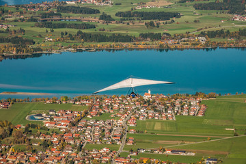 Hang gliding with sails over the Forggensee in Bavaria, Germany