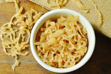 dry pickled sweet radish slicing in cup  on table