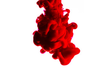 Red blood dropping in the water isolated in white background
