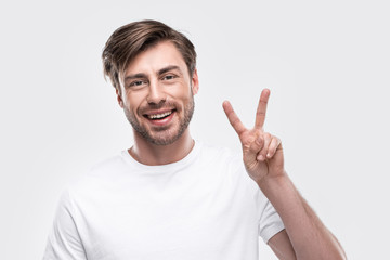 man showing victory sign