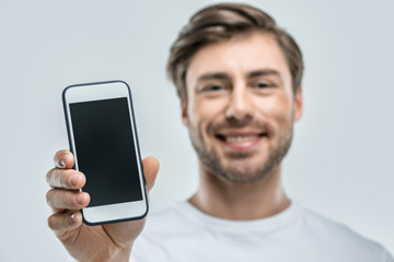 man presenting smartphone