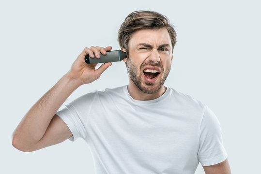 Man Using Electric Trimmer