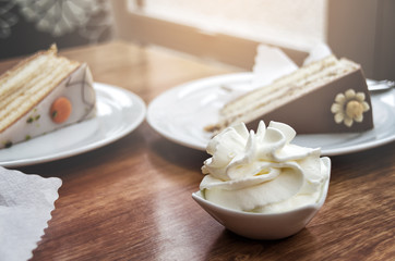 High-calorie breakfast: slices of cake and whipped cream