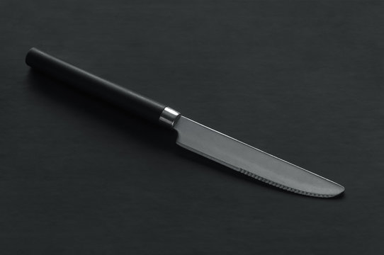 black knife on a dark background