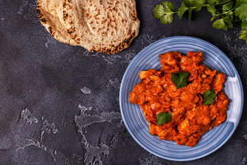 Traditional Indian curry with chicken.