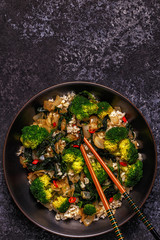 Cooking asian stir fry rice with vegetables