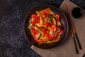 Cooking asian stir fry noodles with vegetables