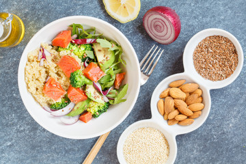 Healthy salad with broccoli, fish and quinoa