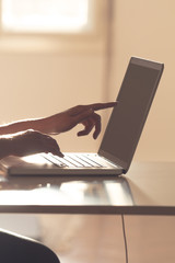 Male hands using keyboard of a lap-top.