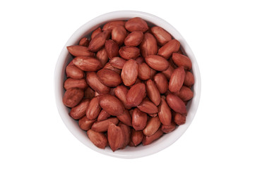 Peanuts in a white bowl on a white background. Isolate. Top view.