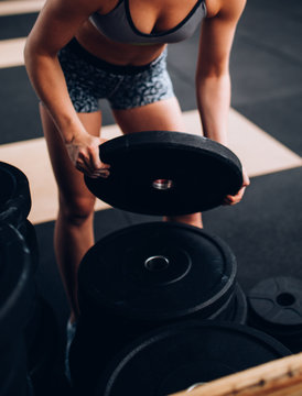 Close up of fit women lifting weights in Gym