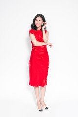Glamour asian woman in stylish red party dress