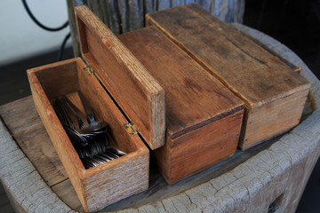 spoon and fork on wood box in restaurant