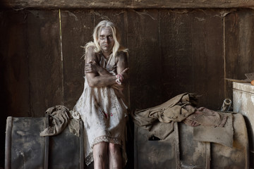 A scene of a young woman in poverty. The young woman is seen to be situated in a poor unclean...