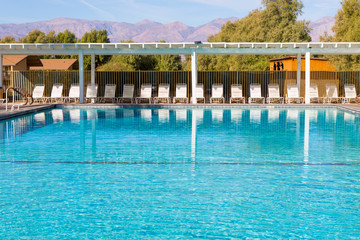 swimming pool with moutain and blue sky