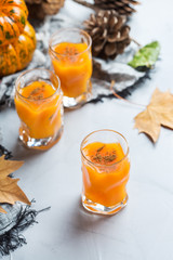 Thanksgiving autumn alcohol drink cocktail beverage with pumpkins and leaves