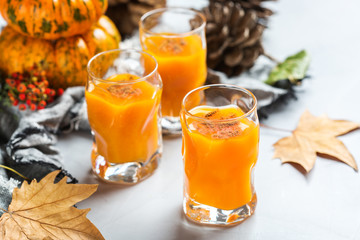 Thanksgiving autumn alcohol drink cocktail beverage with pumpkins and leaves