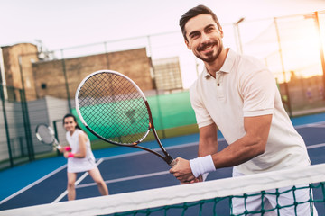 Couple on tennis court
