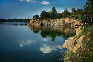 Obraz premium rocky river with pine green trees