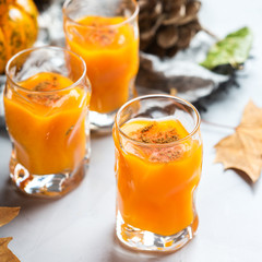 Thanksgiving autumn alcohol drink cocktail beverage with pumpkins and leaves