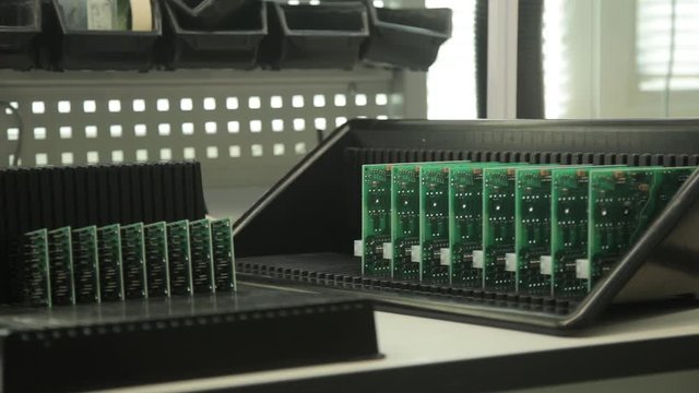 Specialist puts printed circuit boards in box