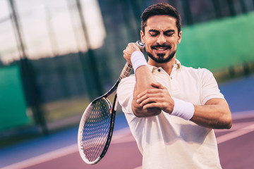 Man on tennis court