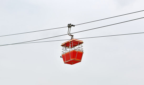 Cable car on white sky background. Retro transportation.