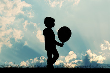 child with balloon silhouette