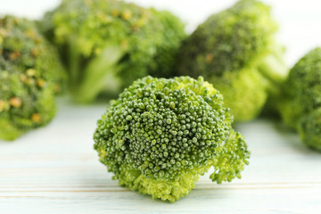 Broccoli on white wooden table