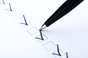 Check boxes on white paper