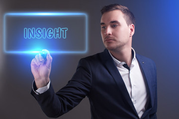 The concept of business, technology, the Internet and the network. Young businessman showing inscription: Insight