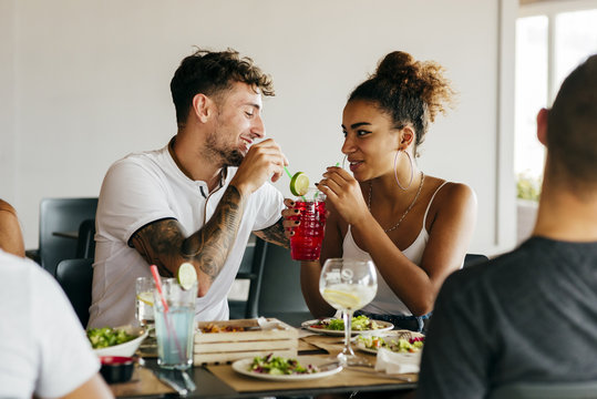 Couple having cocktail together