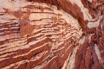 Red sandstone natural background with white stripes.